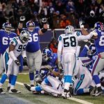 New York Giants' Kareem McKenzie, David Diehl and Michael Matthews signal touchdown as running back Brandon Jacobs, center, scores a touchdown during overtime to give the Giants a 34-28 win.